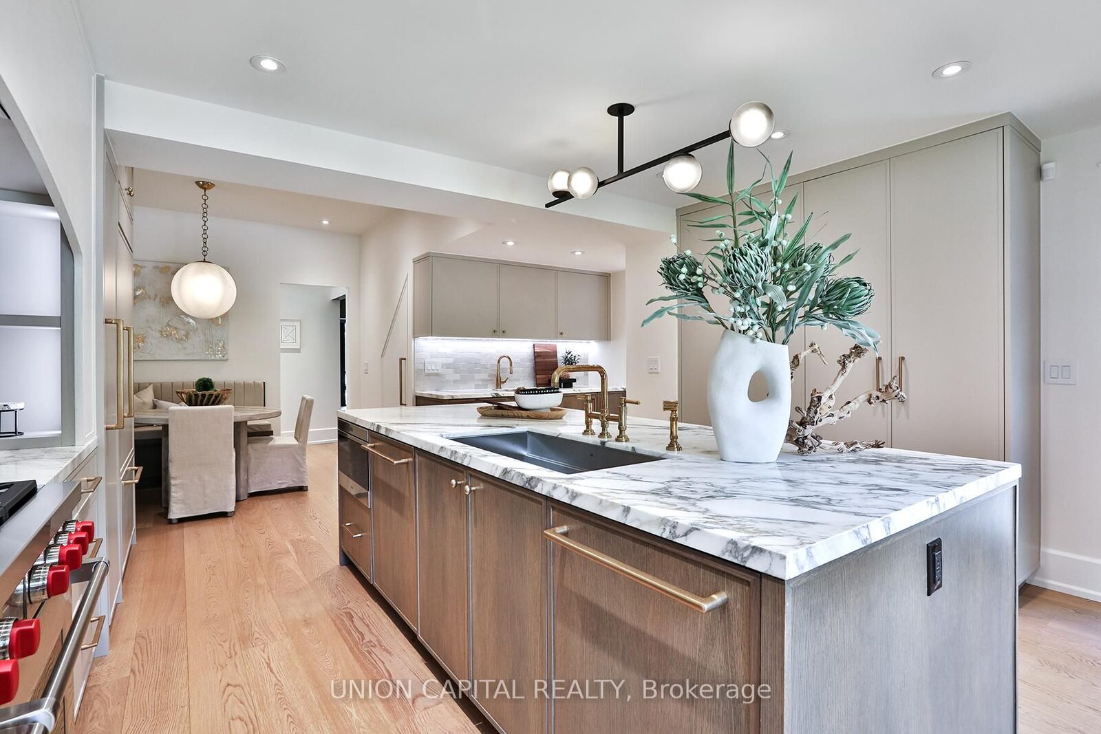 Chef's kitchen with marble island and gas range