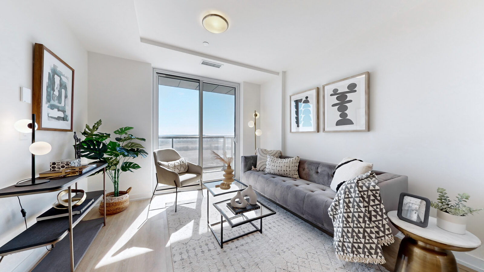 Bright living room with balcony view at 345 Wheat Boom Drive West